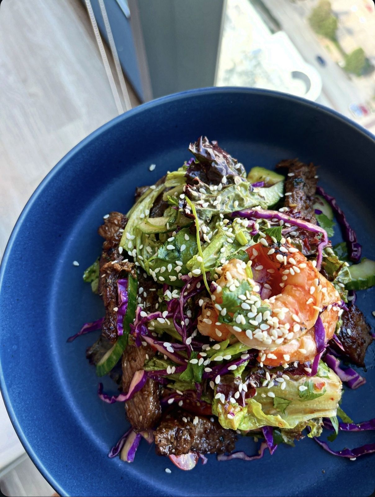 Surf & turf salad with ribeye, grilled shrimp & honey lime dressing